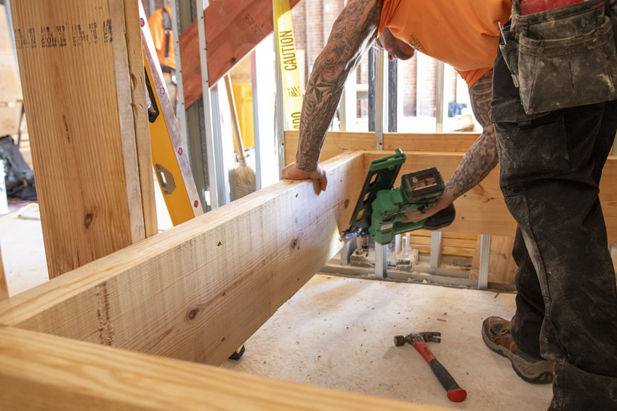 Workers installing stair landing.