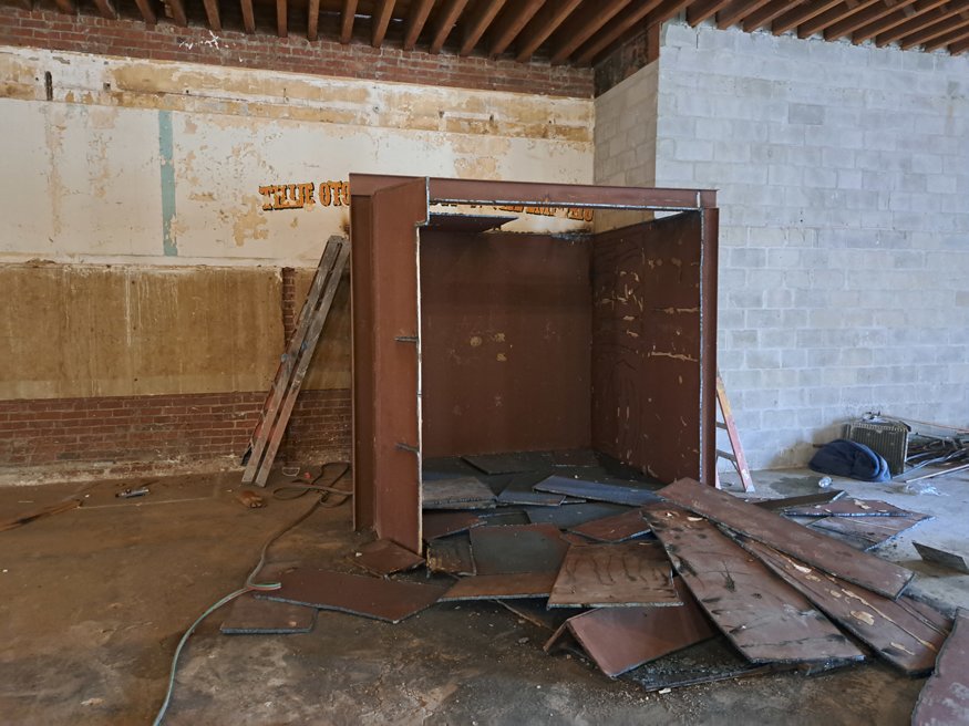 Welded steel vault exposed inside Woolworth during demolition