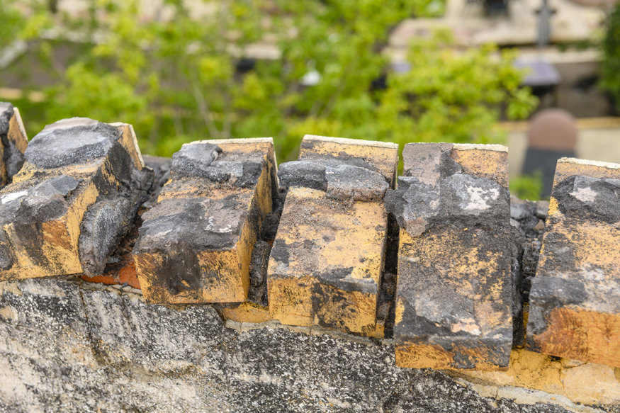 Row of salvaged bricks.