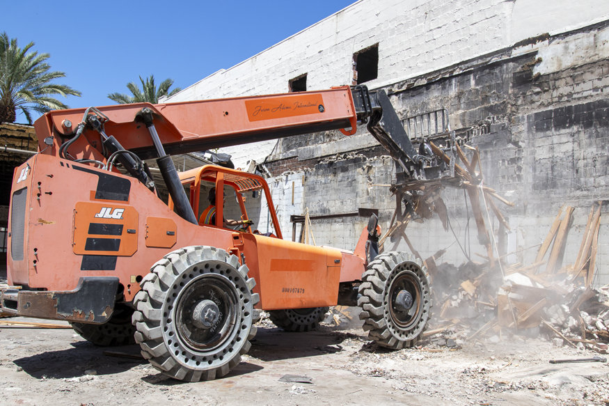 Construction vehicle removing debris. 