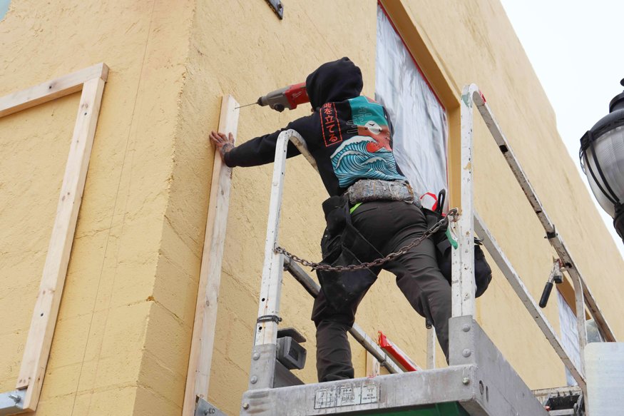 Crews installing templates for the decorative tile.