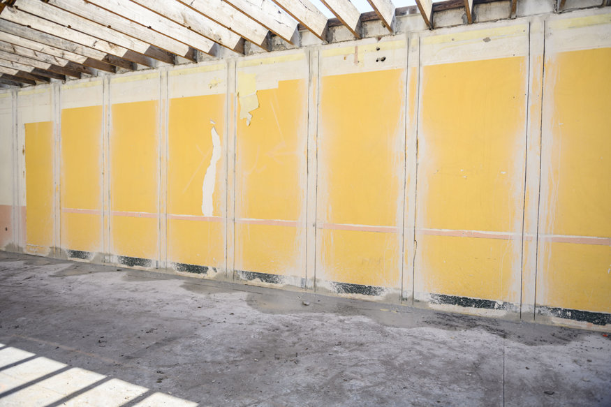 Vertical wall trenches prepared for reinforcement installation.