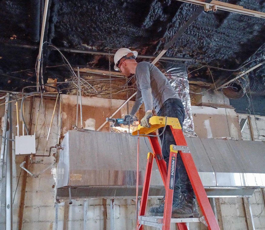 Crew cut the kitchen hood from the ceiling.