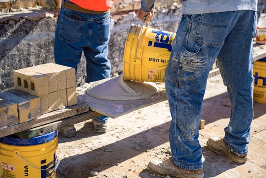 Fresh mortar is poured for usage.