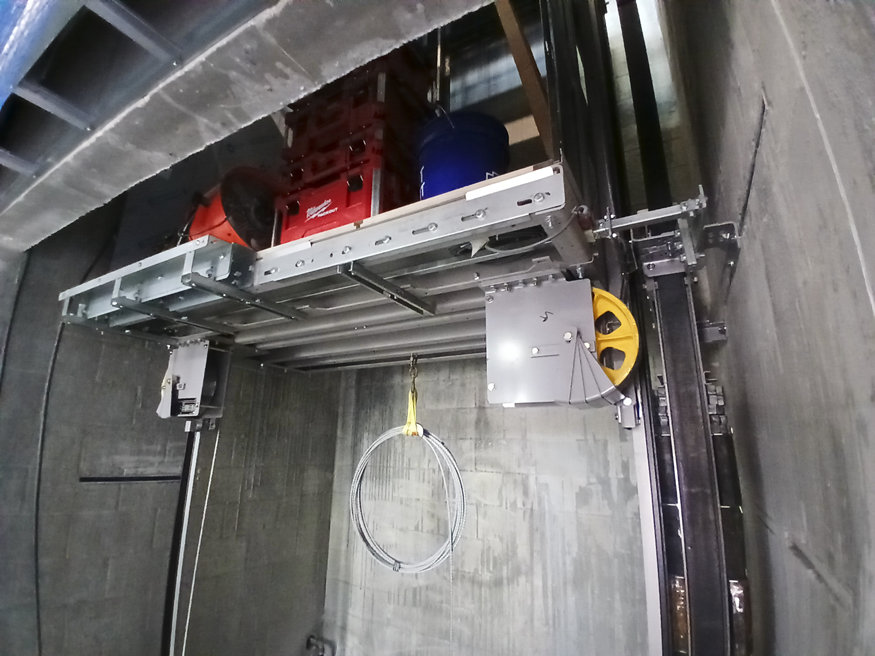 vator shaft retrofit showcasing modernized vertical transportation components.