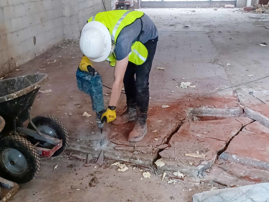  Interior foundation is visible after floor demolition.