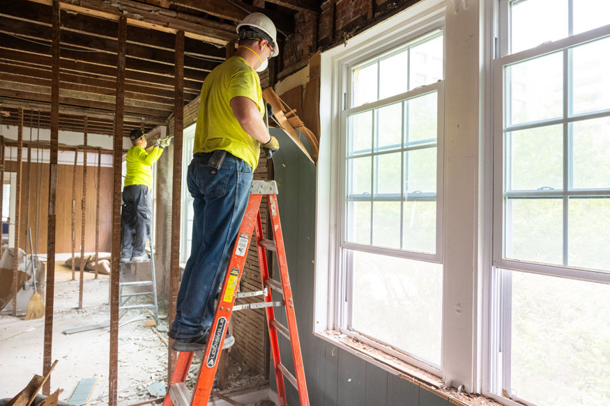 Brick wall and wood lath revealed during demolition. 