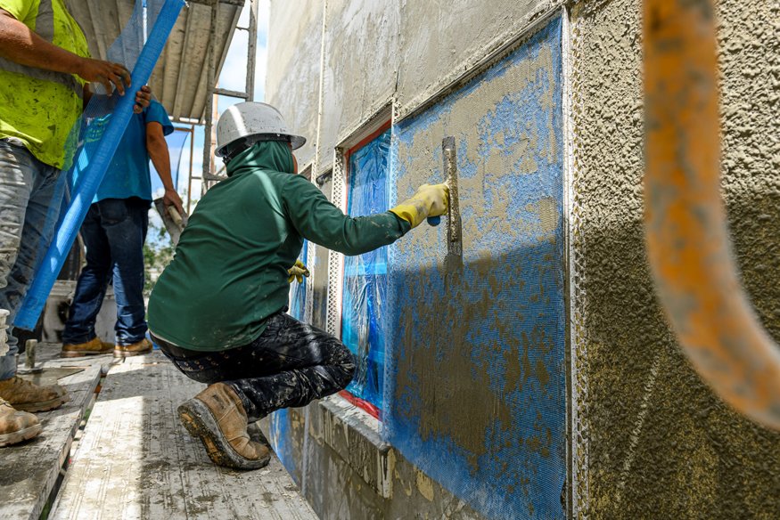 Mesh reinforcement placed in stucco wall section