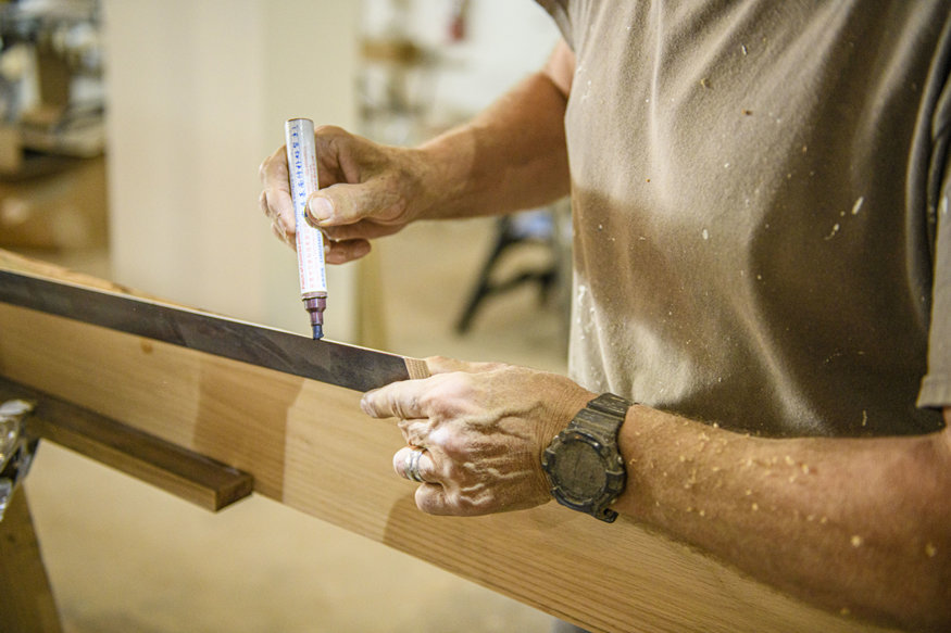 Staining a wainscoting panel.