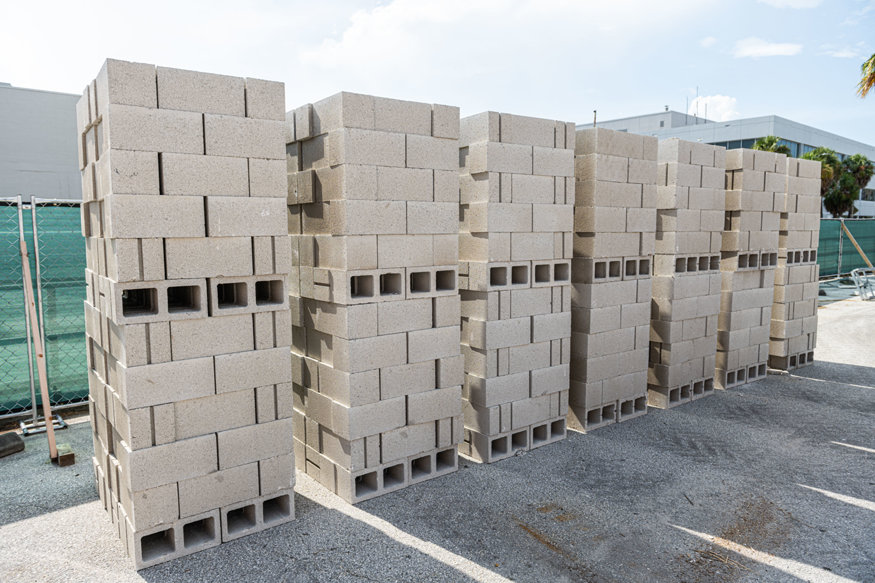Stacked concrete masonry units staged for renovation.