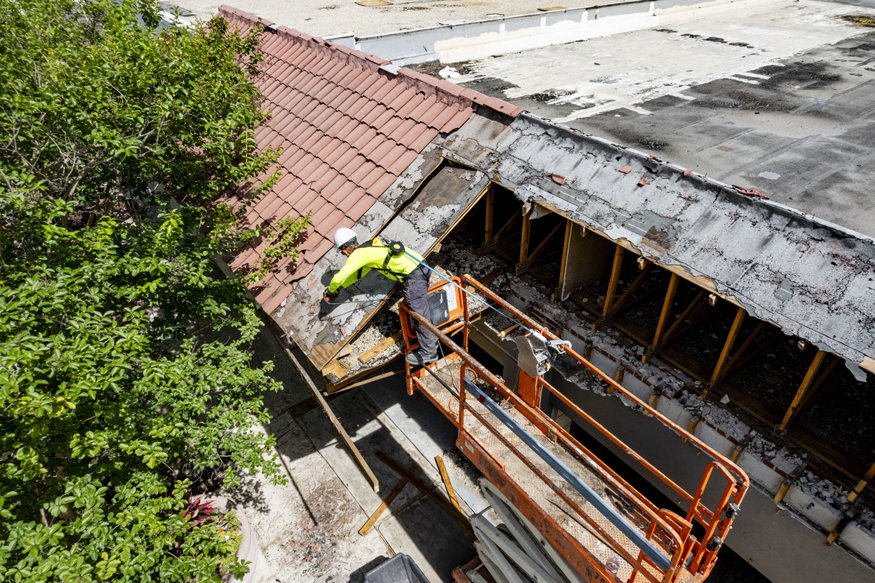 Worker using saw
