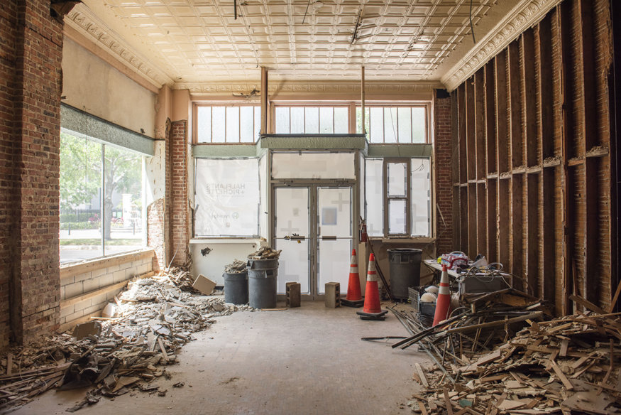 The cleared interior shows its original wood framing.