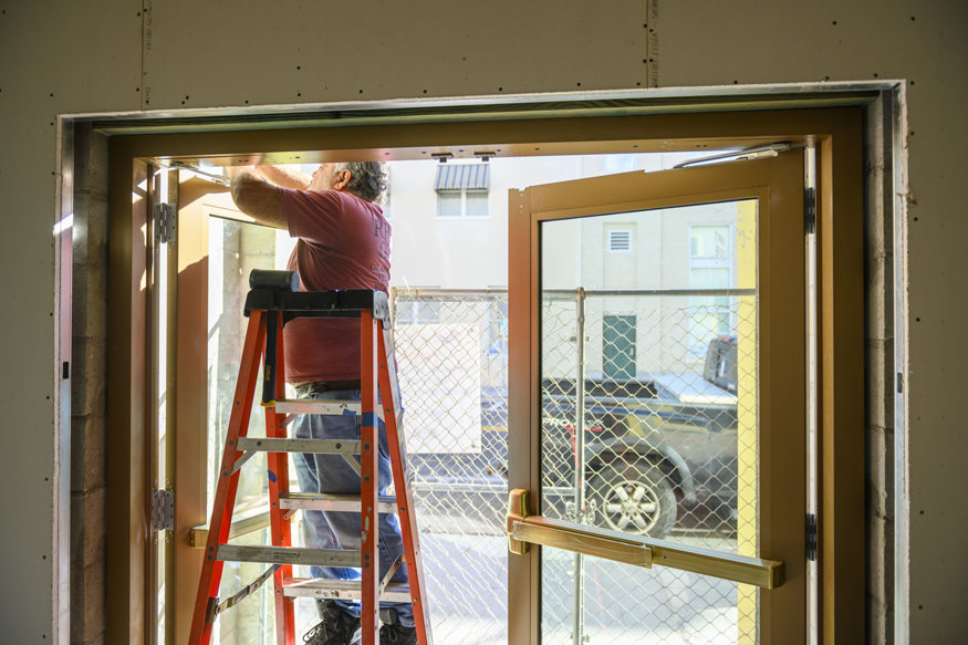 Aligning hardware on entry doors.