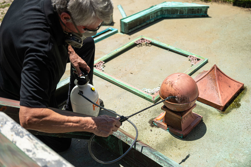 Copper globe cleaned during clock restoration.