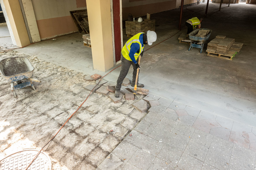 Pavers removed carefully to preserve materials. 