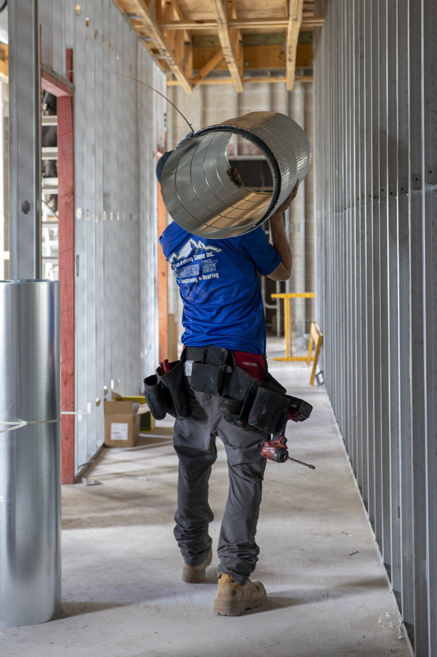 Metal duct carried to installation site.