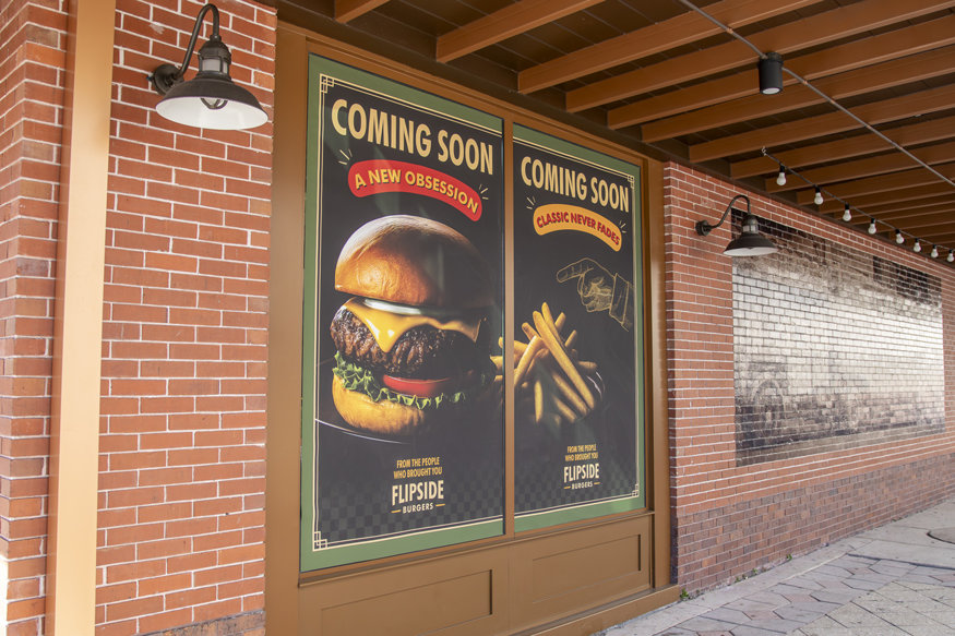 New restaurant signage installed at restored building.