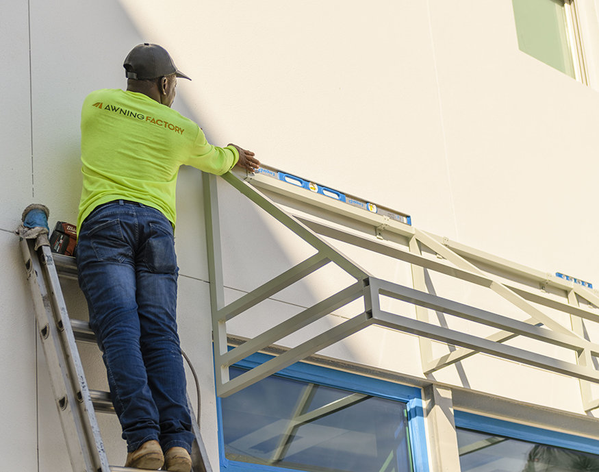 Crew leveling awning frame.