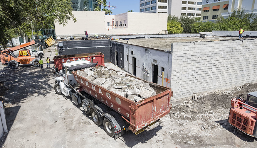 Aerial view of demolition debris removal operations at the 600 block redevelopment site.