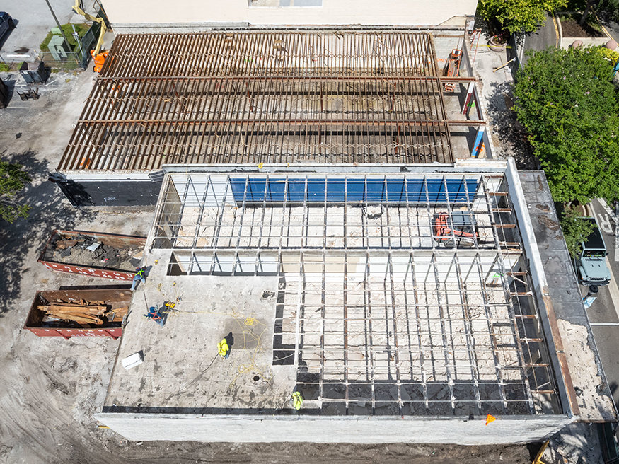 Aerial view of exposed roof framing at 629-633 Cleveland Street.