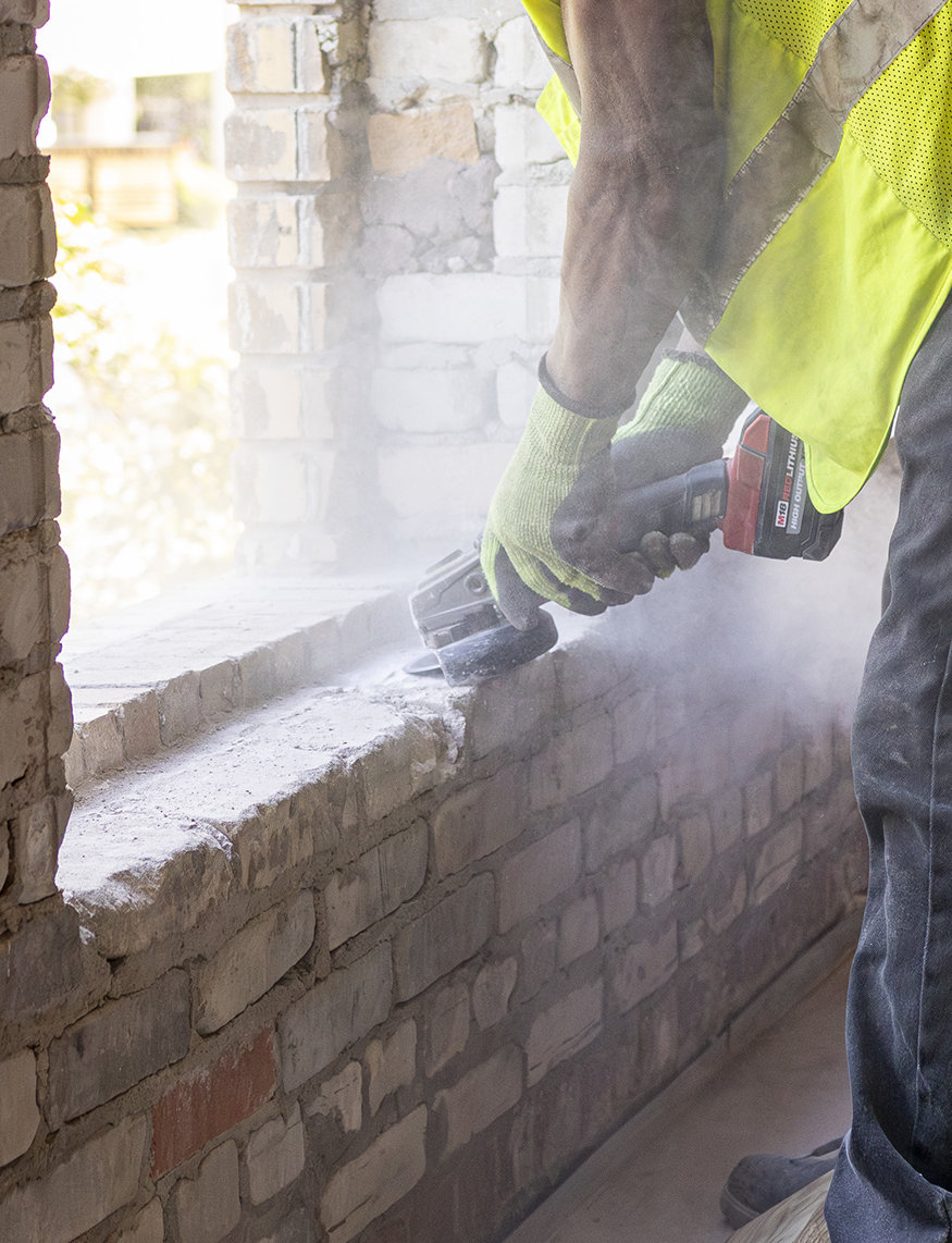 Closeup of bricks being leveled.