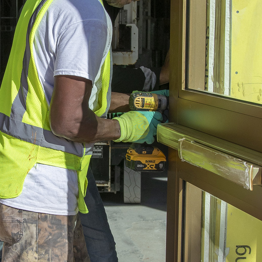 Powder-coated storefront doors.