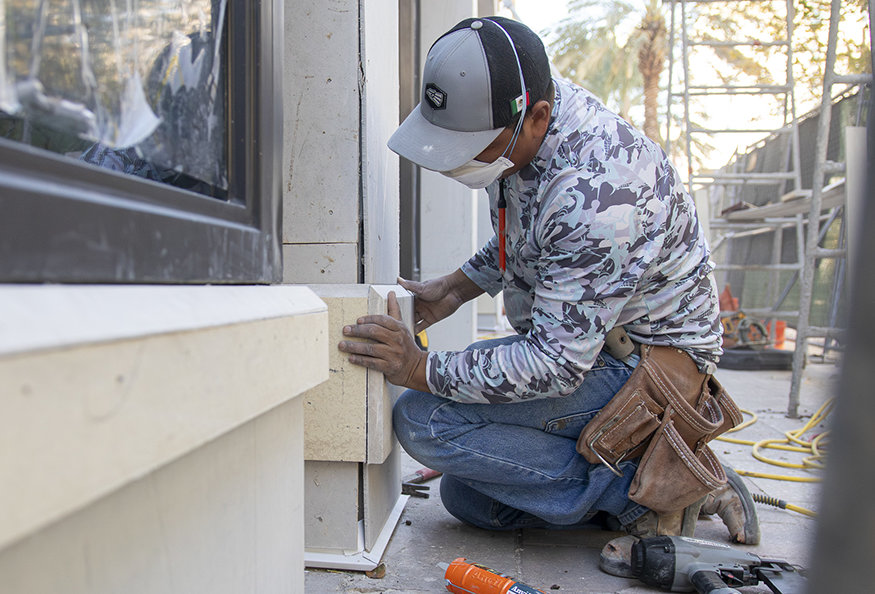 Sequential trim pieces along storefront bays.