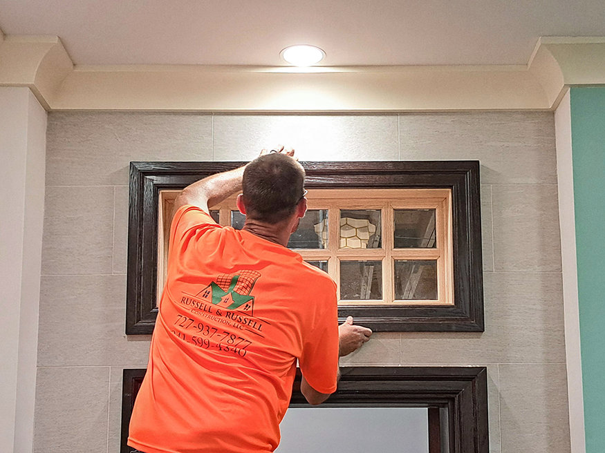Completed transom window above the lobby entrance.