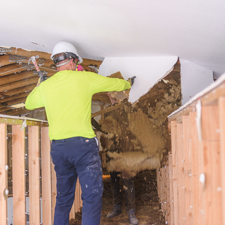 Ceiling trusses exposed after drywall removal.