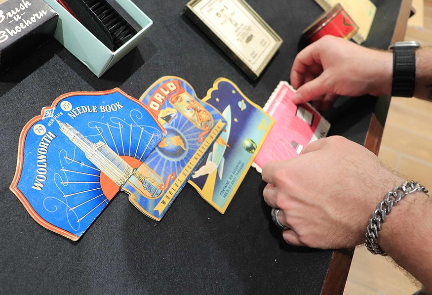 Vintage needle book with price label.